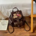 Brown suede and leather backpack with teddy bear embroidery, drawstring closure and flap pocket - 22*12*24cm / Coffee