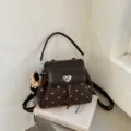 Brown polka-dot shoulder handbag with a dark flap, heart-shaped clasp, and plush charm - No Pendant / 22*10*18 / Coffee