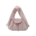 Detail view of the soft pink plush flap, long tassel and gold-tone clasp on the bag - With Pendant / Pink