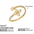 Close-up of a gold-tone open ring with clear stones, floral setting and a slim pavé band - Flower Style (A643) / Size 7 / Gold