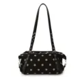 Black polka dot shoulder handbag with an adjustable studded strap and silver-tone hardware - Black