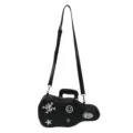 Black guitar-shaped punk handbag with adjustable shoulder strap and decorative patches on white - Black