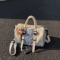 Lightweight nylon tote and crossbody bag in ivory and pale blue with adjustable strap, side view - With Pendant / Blue