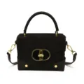 Black suede and leather women's top-handle crossbody bag with gold hardware, shown front-facing - Black