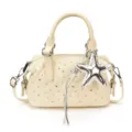Ivory quilted mini handbag with silver rhinestone accents, star charm, and detachable shoulder strap - With Pendant / White