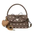 Brown handbag with white polka dots, bow flap, top handle and decorative heart-shaped charms - Brown