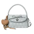 Light blue denim-look polka dot handbag with a bow, heart charm, and detachable shoulder strap - Blue