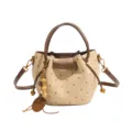 Beige dotted faux suede bucket tote with brown leather handles, shoulder strap and bead charm - Khaki