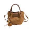 Brown suede-look bucket tote with cream polka dots, top handles, shoulder strap and wood charm - Brown