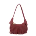 Burgundy suede-look mini shoulder bag with fringe trim and a gold heart charm, shown on white - Burgundy