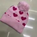 Children's pink knitted beanie with burgundy jacquard hearts, pom-pom and folded ribbed cuff - One Size (3-8 Years) / Heart Light Pink