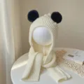 Cream knit children's hat with integrated scarf and black plush bear ears, shown on a display head - Baby 2-5 Years Old Elastic / White
