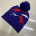 Purple knitted children's beanie with red, gray and white dinosaur pattern and matching pom-pom - One Size (3-8 Years) / Dino Navy Blue