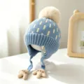 Blue knitted children's winter hat with cream jacquard stripes, pompom and earflap ties - Baby 1-3 Years Elastic / Palm Blue