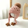 Pink children's knit hat with brown checks, pompom, ties and hand-shaped earflap ornaments - Baby 1-3 Years Elastic / Palm Pink