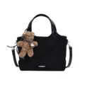 Black suede-look tote shoulder bag with silver accents and a plush teddy bear charm - With Pendant / Black