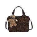 Leopard-print tote handbag with dark brown handles, shoulder strap, and teddy bear charm - With Pendant / Leopard Print