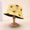Sunflower-print bucket hat displayed on a wooden stand, with its plain black underside visible - M (56-58cm) / Sunflower Reversible Style (8)