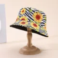 Bucket hat on a wooden stand, with sunflower and green leaf prints over zebra stripes - M (56-58cm) / Sunflower Zebra Pattern Reversible Style (9)