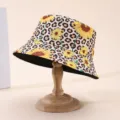 Sunflower and leopard-print hat displayed on a wooden stand, with a contrasting black inner brim - M (56-58cm) / Sunflower Leopard Reversible Style (12)