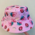 Close-up view of a pink hat with colorful strawberry prints, blue-green leaves, and stitched brim - M (56-58cm) / Pink Strawberry Printed Style (21)
