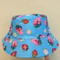Close-up of a blue hat with strawberry, flower and leaf prints and rows of stitching on the brim - M (56-58cm) / Blue Strawberry Printed Style (19)