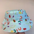View of colorful playful letter and macaroni prints across pale blue bucket hat fabric - M (56-58cm) / Light Blue Colorful Printed Style (16)