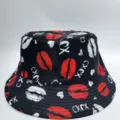 Black bucket hat shown flat, with an all-over print of red and white lips, hearts, and XOXO - M (56-58cm) / Black Base Red Lip Print Style (29)