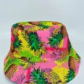 Close-up of a vivid pineapple-print hat in pink, yellow and green, with a stitched brim - M (56-58cm) / Pineapple Ink Print Style (33)