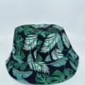 Dark navy bucket hat with a vivid green tropical leaf print, shown from the front - M (56-58cm) / Dark Green Leaf Style (45)
