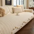 Ivory sofa cover with raised stripe texture and matching pom-pom fringe, shown on a sofa. - Dotted Texture (Dianxu) / 70*70cm / Off White