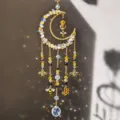 Close-up of a gold crescent ornament with crystal beads, dangling bee and honeycomb charms - Moon Bee (26045)