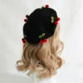Black wool beret with red pom-pom cherries and green leaves, shown on a mannequin - M (56-58cm) / Red Cherry Black Hat