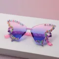 Close-up of rimless butterfly sunglasses with pink-purple gradient lenses and birthday letter beads - Pink to Blue Gradient
