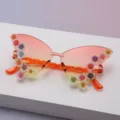 Rimless butterfly lenses fade from pink to yellow, with colorful raised flowers and orange temples - Orange to Yellow Gradient