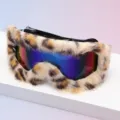 Close-up of leopard-print faux-fur trim surrounding ski goggles with a colorful mirrored lens - Leopard Fur