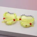 Yellow translucent frames with colorful beads spelling “MERRY CHRISTMAS” and star accents - Yellow