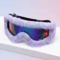 Close-up of purple-blue fluffy trim framing reflective ski goggle lenses on a clean display surface - Purple Blue Gradient Plush