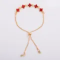 Detail showing five red rhinestone flowers, gold links, and adjustable sliding clasp on a bracelet - Red (5329)