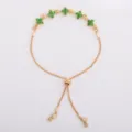 Flat lay of a gold-tone chain with five green flower-shaped stones and an adjustable slider clasp - Green (5331)