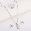 Flat lay of silver-tone swan jewelry with white pearl and crystal accents on a light surface - Silver Swan Jewelry Set (8548) / Silver