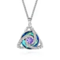 Close-up view of a silver Celtic knot pendant with blue-green crystals and a central purple gemstone - Square Pearl Chain / February Purple