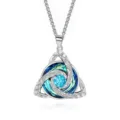 Silver knot pendant with a blue center stone and blue-green crystal accents on white - Square Pearl Chain / March Light Blue