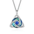 Close-up of a silver Celtic knot pendant with a blue center stone and teal-blue crystal accents - Square Pearl Chain / December Light Blue