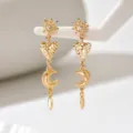 Orecchini dorati con stelle scintillanti, cuori martellati e pendenti a forma di mezzaluna - Oro