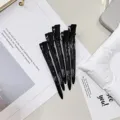 Set of five black metal duckbill hair clips with sleek finish, shown arranged on a light surface - 5 Pieces/Pack / Black