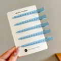 Five blue metal duckbill hair clips with perforated bodies and a smooth matte finish - 5 Pieces/Pack / Blue