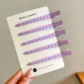 Set of five purple plastic duckbill hair clips with perforated shanks, displayed on a white card - 5 Pieces/Pack / Purple