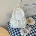 Sac à dos blanc pour enfant, imprimé d'étoiles colorées, poche avant à cordon et compartiment zippé - Style Étoile