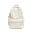Sac à dos léger couleur ivoire à pois gris, avec plusieurs compartiments zippés, vu de face - Sac Seul / Blanc